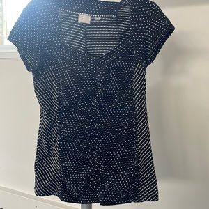 Adorable polka fit reverse chevron touched top